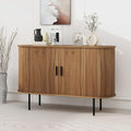 Gerundete Konturen und ein Metallgestell an dem Sideboard